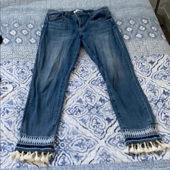 jeans with tassels at the bottom